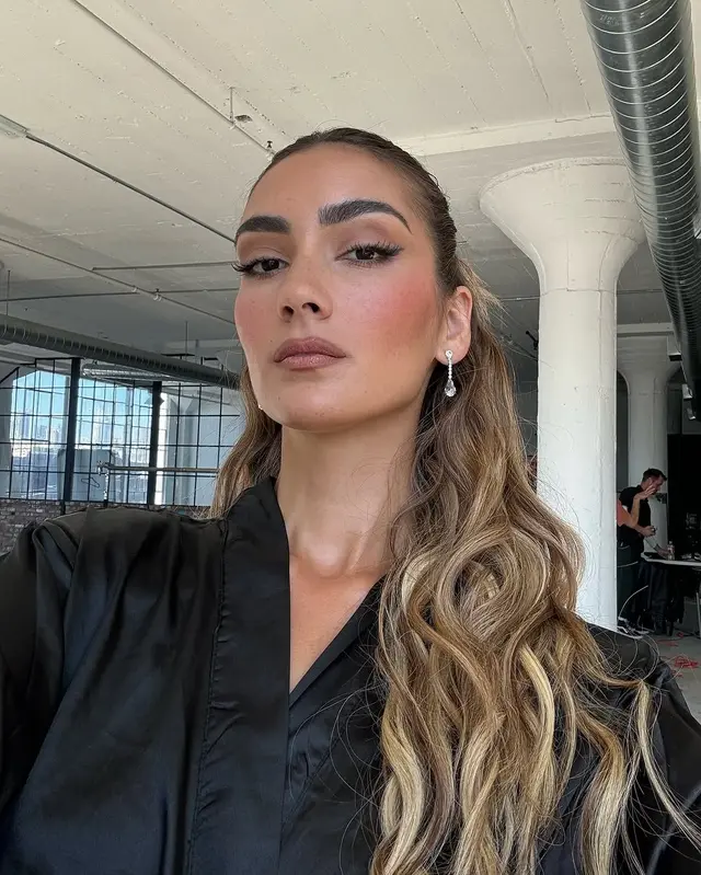Backstage glow makeup at a fashion show